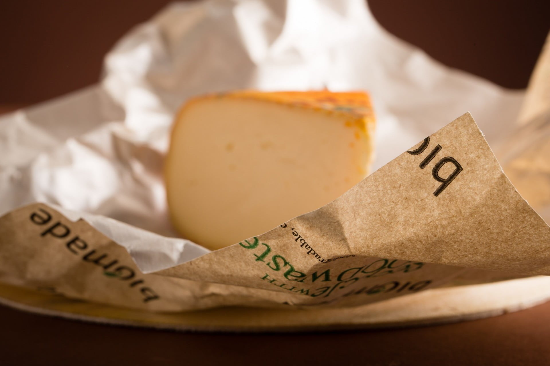 Oil and grease resistant packaging for cheese